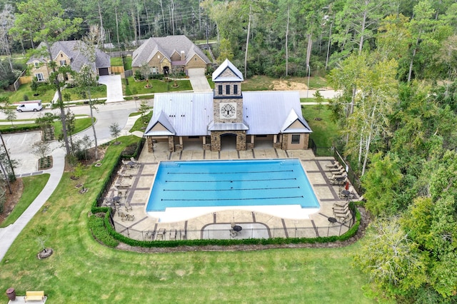 510 Blossom Cove Ct, Pinehurst, TX 77362 - view of pool with fence, a patio area, and a forest view