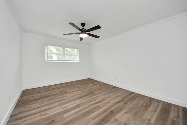 5638 N Braeswood Blvd, Houston, TX 77096 - unfurnished room with wood finished floors, a ceiling fan, crown molding, and baseboards