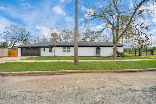 5638 N Braeswood Blvd, Houston, TX 77096 - view of front of property featuring driveway, a garage, a chimney, and a shingled roof