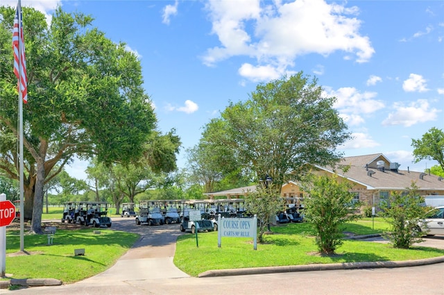 734 E Country Grove Cir, Pearland, TX 77584 - view of home's community with a lawn