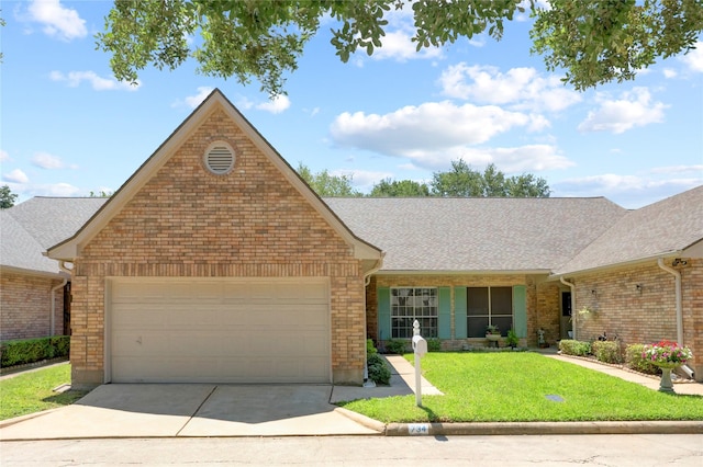 734 E Country Grove Cir, Pearland, TX 77584 - view of front of house featuring an attached garage, concrete driveway, brick siding, and a front yard