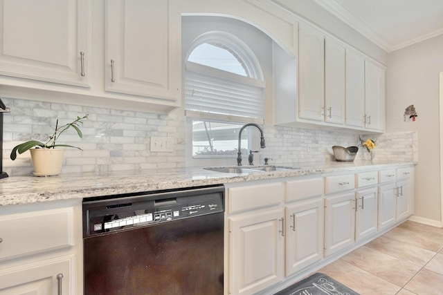 4106 Alice Dr, Sugar Land, TX 77478 - kitchen featuring black dishwasher, a sink, white cabinets, ornamental molding, and light stone counters
