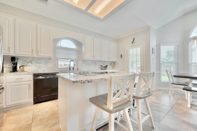 4106 Alice Dr, Sugar Land, TX 77478 - kitchen with black appliances, plenty of natural light, tasteful backsplash, light tile patterned flooring, and ornamental molding