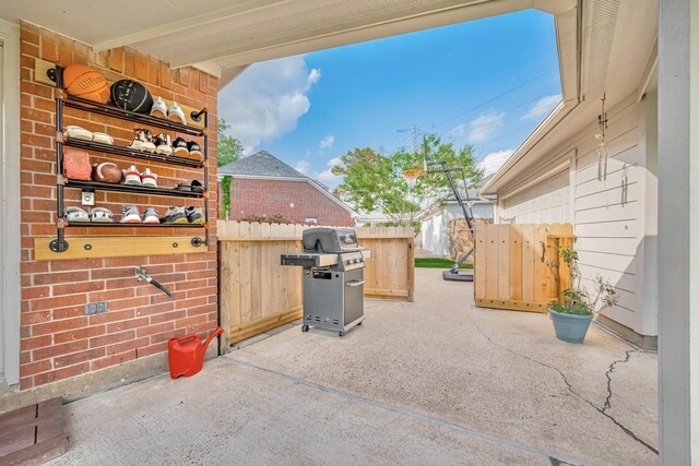 4106 Alice Dr, Sugar Land, TX 77478 - view of patio featuring a grill and fence