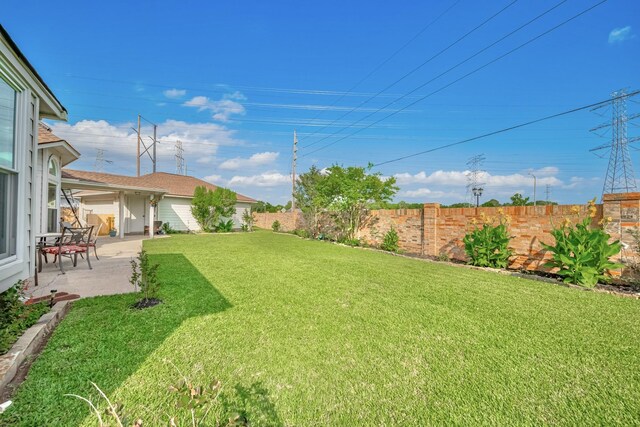 4106 Alice Dr, Sugar Land, TX 77478 - view of yard with a patio