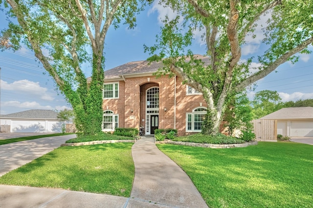 4106 Alice Dr, Sugar Land, TX 77478 - view of front facade with brick siding and a front yard