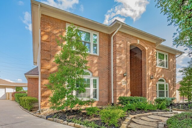4106 Alice Dr, Sugar Land, TX 77478 - view of front of home with brick siding and a garage