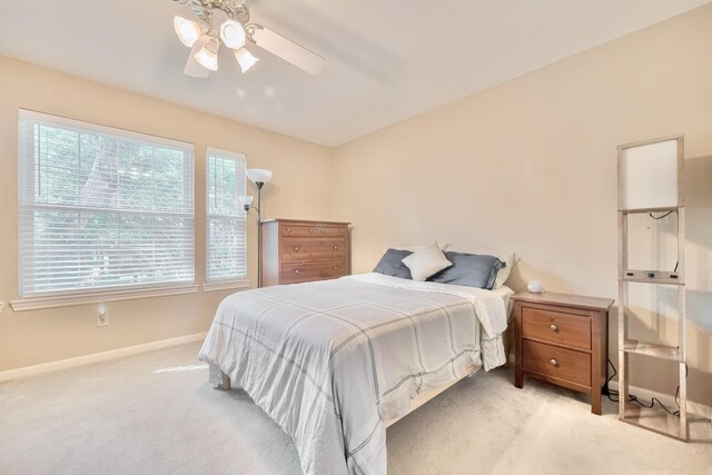 4106 Alice Dr, Sugar Land, TX 77478 - bedroom featuring light colored carpet, baseboards, and ceiling fan