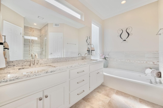 4106 Alice Dr, Sugar Land, TX 77478 - bathroom featuring a stall shower, double vanity, a garden tub, ornamental molding, and tile patterned floors