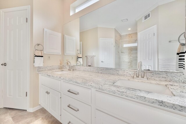 4106 Alice Dr, Sugar Land, TX 77478 - full bathroom with a shower stall, double vanity, crown molding, tile patterned floors, and baseboards