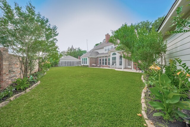 4106 Alice Dr, Sugar Land, TX 77478 - view of yard featuring a patio area