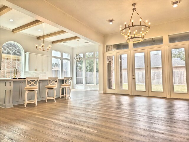 9923 Eden Valley Dr, Spring, TX 77379 - dining room featuring a chandelier, light wood finished floors, beamed ceiling, recessed lighting, and crown molding