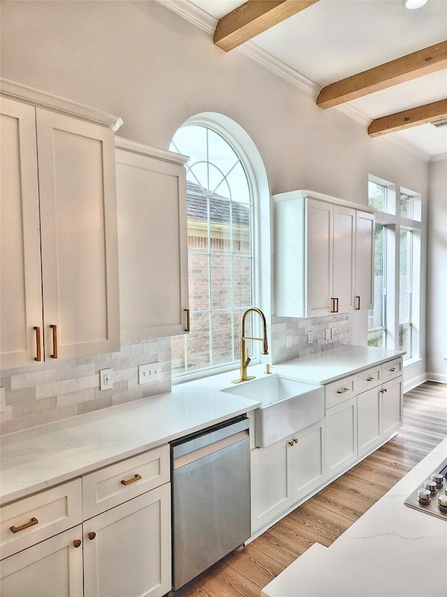 9923 Eden Valley Dr, Spring, TX 77379 - kitchen featuring dishwasher, a sink, beam ceiling, decorative backsplash, and light wood finished floors