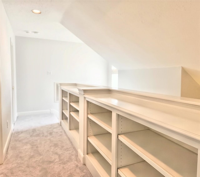 9923 Eden Valley Dr, Spring, TX 77379 - hall featuring light colored carpet, vaulted ceiling, and baseboards
