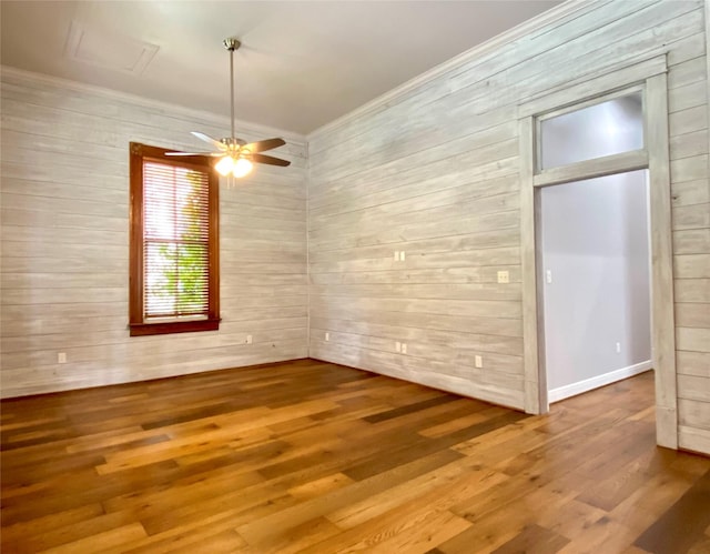 2012 Avenue N 1/2 Ave N 1/2, Galveston, TX 77550 - unfurnished dining area featuring wood finished floors, wood walls, crown molding, and a ceiling fan