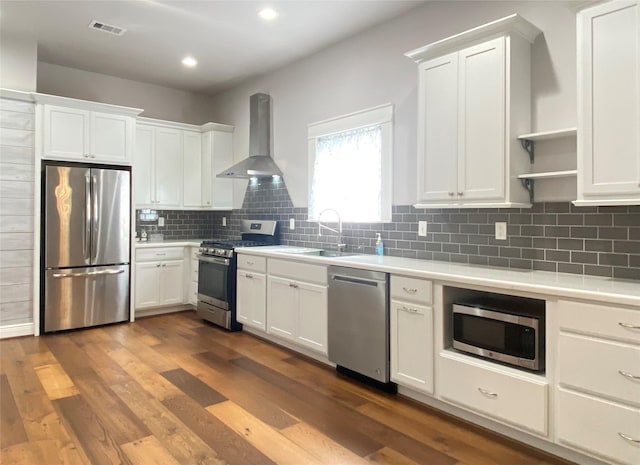 2012 Avenue N 1/2 Ave N 1/2, Galveston, TX 77550 - kitchen with appliances with stainless steel finishes, wall chimney exhaust hood, open shelves, light countertops, and white cabinetry