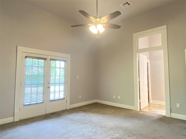 2012 Avenue N 1/2 Ave N 1/2, Galveston, TX 77550 - carpeted empty room featuring a ceiling fan and french doors