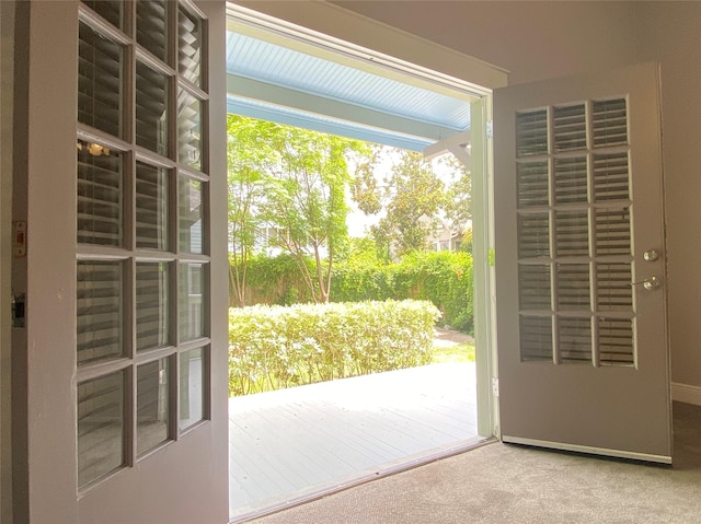 2012 Avenue N 1/2 Ave N 1/2, Galveston, TX 77550 - doorway to outside featuring carpet
