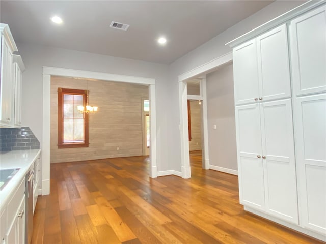 2012 Avenue N 1/2 Ave N 1/2, Galveston, TX 77550 - kitchen featuring light wood-style flooring, a chandelier, recessed lighting, light countertops, and dishwasher