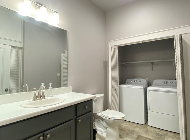 2012 Avenue N 1/2 Ave N 1/2, Galveston, TX 77550 - bathroom featuring washing machine and dryer, a closet, and vanity