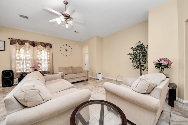 3018 Wellington Pass Dr, Spring, TX 77373 - living area featuring arched walkways, a ceiling fan, baseboards, and light tile patterned floors