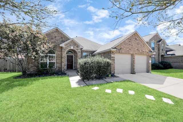 3018 Wellington Pass Dr, Spring, TX 77373 - traditional home featuring brick siding, an attached garage, and driveway