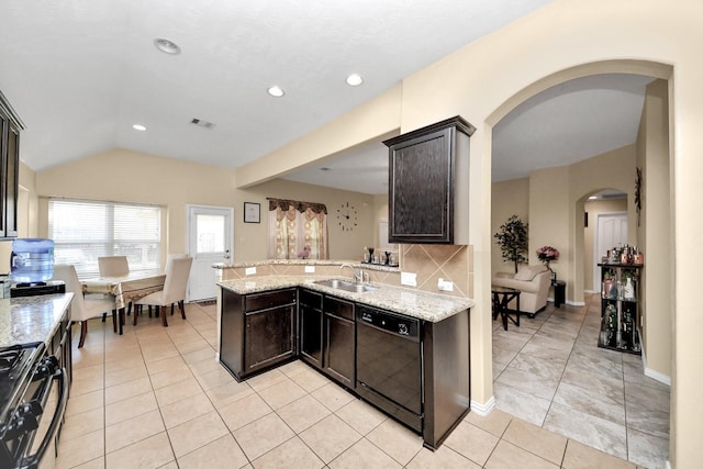 3018 Wellington Pass Dr, Spring, TX 77373 - kitchen featuring black dishwasher, arched walkways, a sink, gas range oven, and light stone countertops