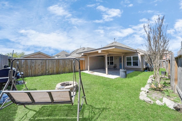 3018 Wellington Pass Dr, Spring, TX 77373 - rear view of property with a patio and an outdoor fire pit