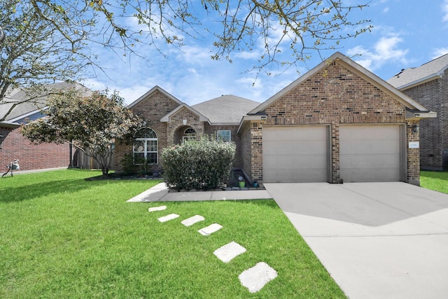 3018 Wellington Pass Dr, Spring, TX 77373 - view of front facade with an attached garage, brick siding, a front lawn, driveway, and a shingled roof