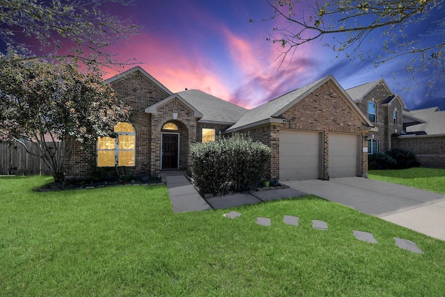 3018 Wellington Pass Dr, Spring, TX 77373 - traditional-style house with brick siding, a garage, driveway, and a yard