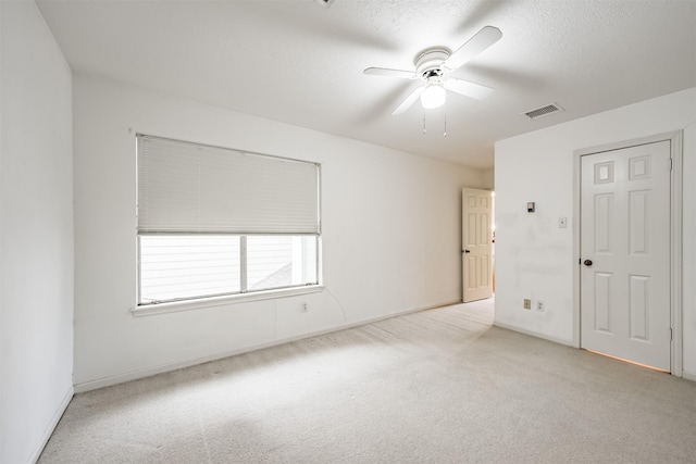4315 Westheimer Rd, Houston, TX 77027 - unfurnished bedroom with light carpet, baseboards, and a ceiling fan