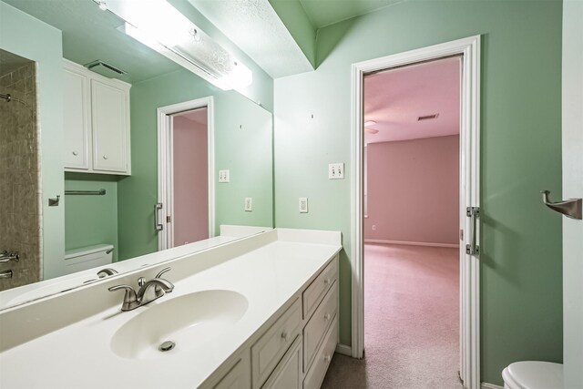 4315 Westheimer Rd, Houston, TX 77027 - full bathroom featuring toilet, vanity, a shower, and baseboards