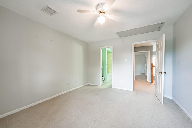 4315 Westheimer Rd, Houston, TX 77027 - unfurnished bedroom featuring attic access, light colored carpet, baseboards, ceiling fan, and connected bathroom
