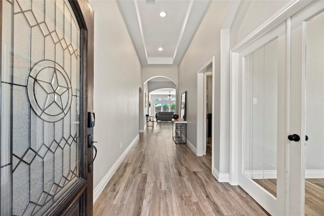 20123 Everhart Springs Ln, Cypress, TX 77433 - entrance foyer with arched walkways, wood finished floors, baseboards, and recessed lighting