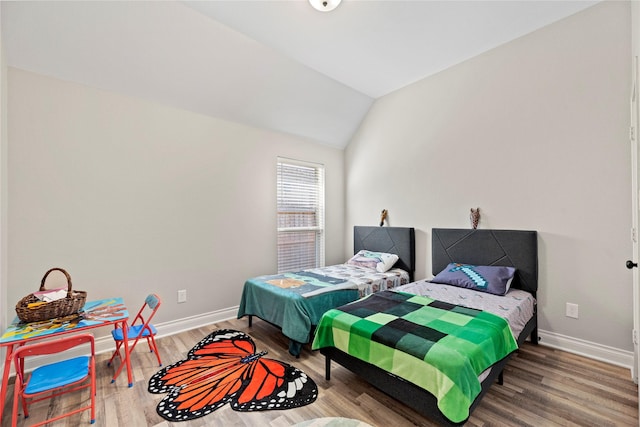 20123 Everhart Springs Ln, Cypress, TX 77433 - bedroom with baseboards, wood finished floors, and lofted ceiling