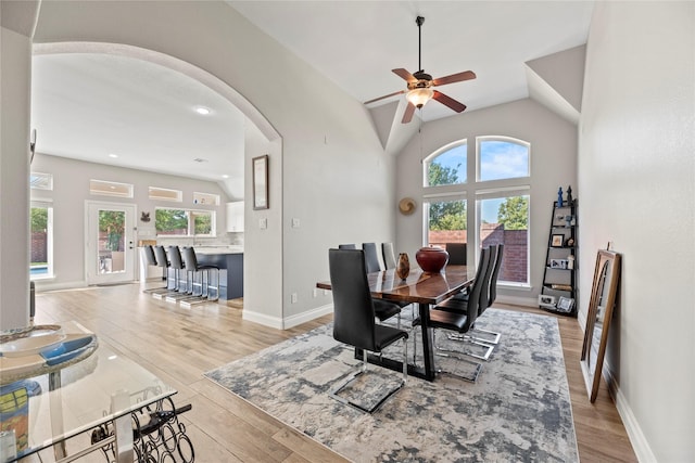 20123 Everhart Springs Ln, Cypress, TX 77433 - dining space featuring arched walkways, a ceiling fan, light wood-style flooring, vaulted ceiling, and baseboards