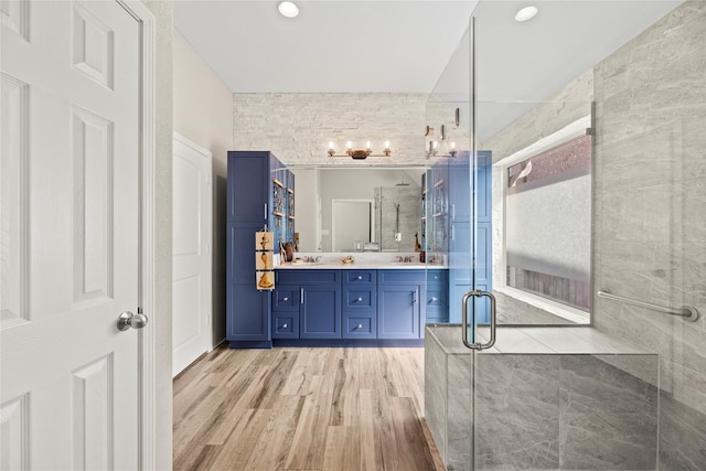 20123 Everhart Springs Ln, Cypress, TX 77433 - full bath with wood finished floors, a stall shower, and double vanity