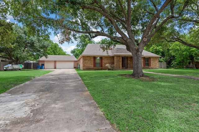 1520 Sycamore St, Navasota, TX 77868 - view of front of home with a garage, brick siding, driveway, and roof with shingles