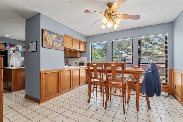1520 Sycamore St, Navasota, TX 77868 - dining room featuring plenty of natural light, ceiling fan, a textured ceiling, and light tile patterned floors