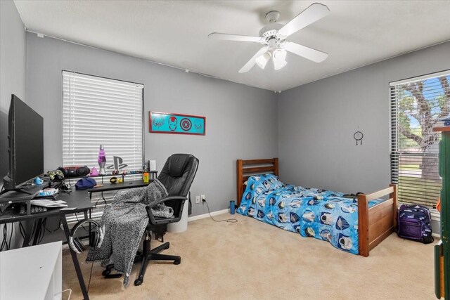 1520 Sycamore St, Navasota, TX 77868 - carpeted bedroom with an office area, ceiling fan, and baseboards