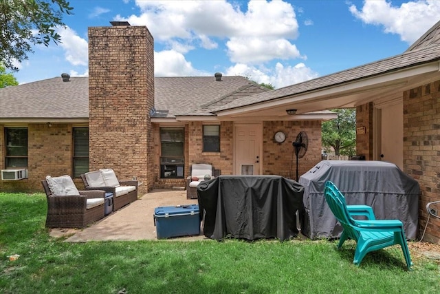 1520 Sycamore St, Navasota, TX 77868 - back of property featuring a chimney, roof with shingles, an outdoor hangout area, a yard, and a patio