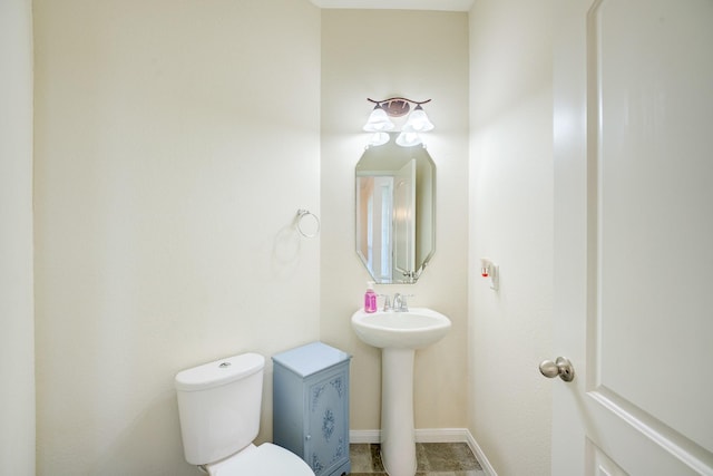 13203 Edison Trace Ln, Tomball, TX 77377 - bathroom featuring toilet, baseboards, and a sink
