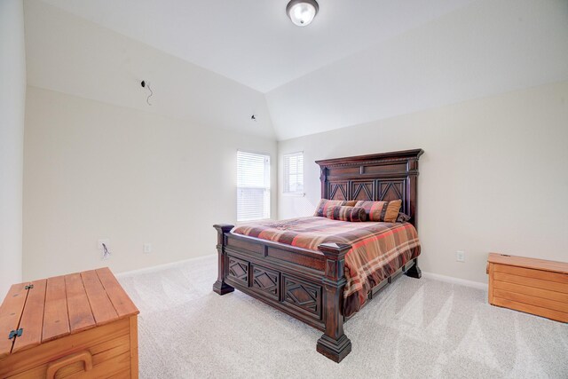 13203 Edison Trace Ln, Tomball, TX 77377 - carpeted bedroom featuring vaulted ceiling and baseboards