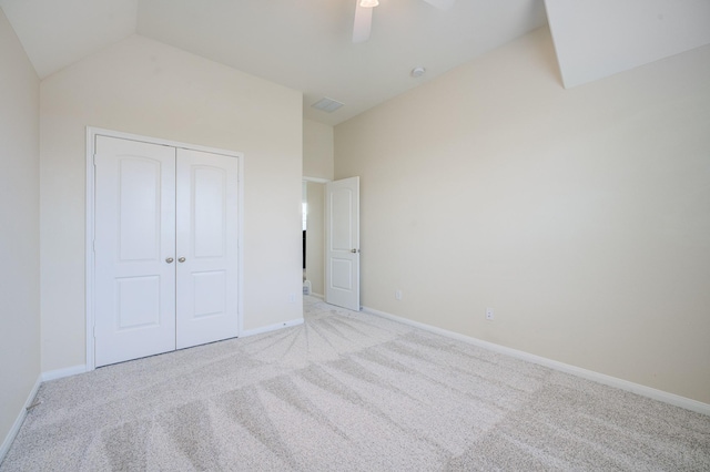13203 Edison Trace Ln, Tomball, TX 77377 - unfurnished bedroom with light colored carpet, a closet, vaulted ceiling, baseboards, and ceiling fan