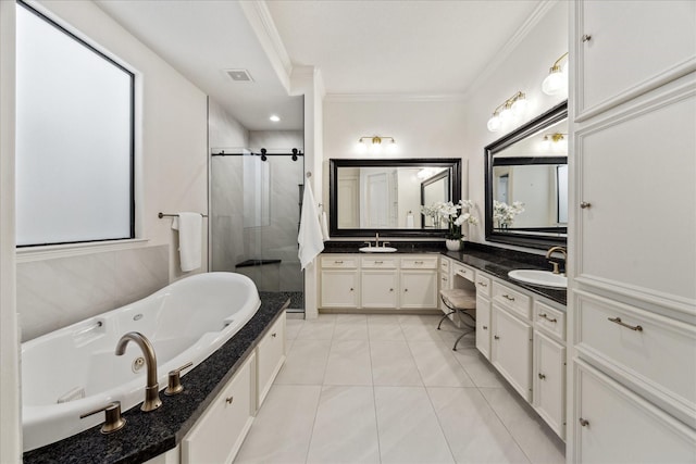 614 W Bell St Unit A, Houston, TX 77019 - bathroom with crown molding, a shower stall, a jetted tub, double vanity, and tile patterned flooring