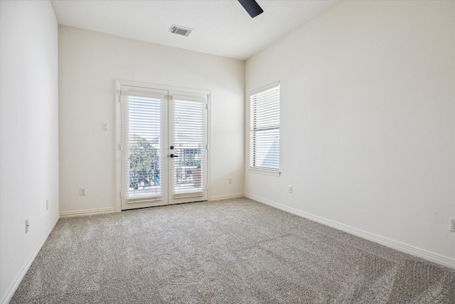 614 W Bell St Unit A, Houston, TX 77019 - unfurnished room featuring a ceiling fan, carpet, french doors, and baseboards