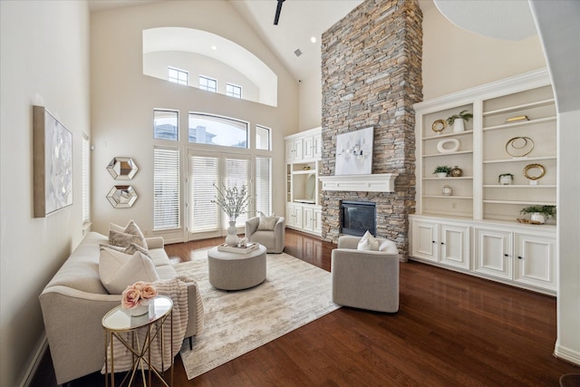 614 W Bell St Unit A, Houston, TX 77019 - living room featuring a stone fireplace, high vaulted ceiling, and dark wood-style flooring