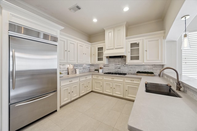 614 W Bell St Unit A, Houston, TX 77019 - kitchen featuring built in refrigerator, a sink, tasteful backsplash, light countertops, and crown molding