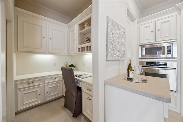614 W Bell St Unit A, Houston, TX 77019 - kitchen with appliances with stainless steel finishes, open shelves, light countertops, crown molding, and white cabinets