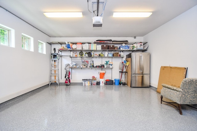 4006 Feagan St Unit D, Houston, TX 77007 - garage with freestanding refrigerator, baseboards, and a garage door opener